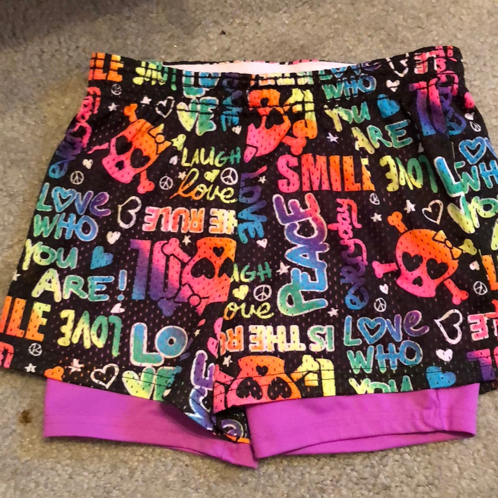 Black with tie dye all over it from justice